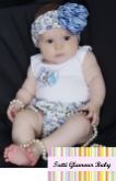 Conjunto tapa fralda com body e faixa.